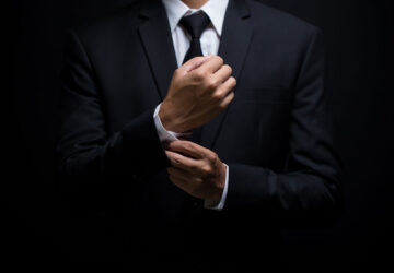 businessman-adjusting-his-cufflinks