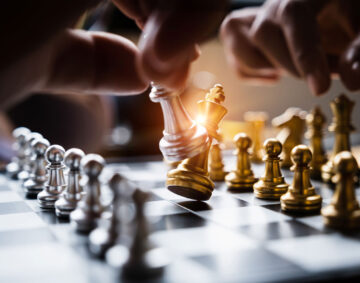 businessman-playing-moving-chess-figure-competition-success-play